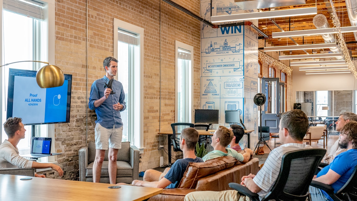 Strategy review meeting with printed brand platform pages